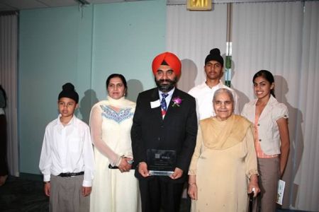 Dr Kang Wins the KVIE Unsung Hero Award, Dr Kang with His Family, 2006.  Courtesy of the Kang Family.