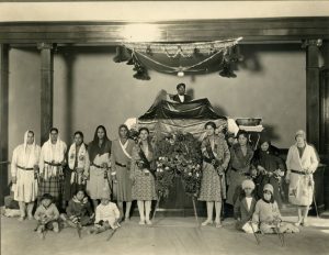 Kartar Dhillon is standing to the right of the wreath